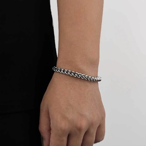 Close-up of a 6mm stainless steel spring clasp chain bracelet worn by a male model