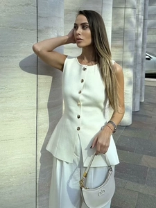 Women's white slim-fit sleeveless knit vest with gold buttons for a stylish autumn look