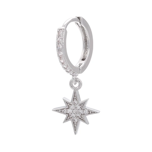 Macro shot of silver starburst earrings featuring pavé cubic zirconia star charms