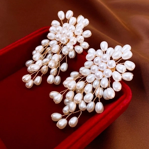 Elegant firework pearl cluster earrings with gold wire in a red velvet jewelry box