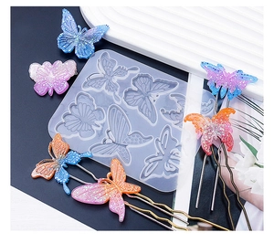Détail du moule en silicone papillon pour résine avec épingles à cheveux dégradées