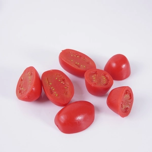 Realistic artificial cherry tomato models showing whole and sliced fruit details