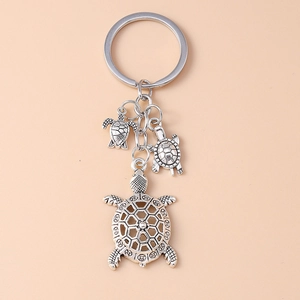 Creative vintage silver turtle keychain with hollow pendant for bags and phone charms