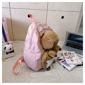 Pink Capybara backpack featuring a transparent front pocket with a plush toy inside