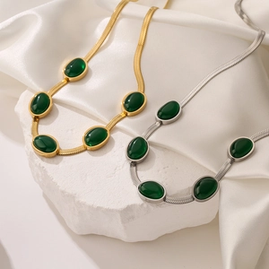 Vintage emerald snake chain necklaces in gold and silver finish with green oval gems