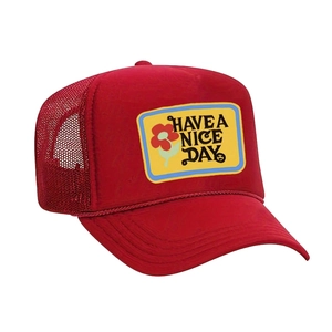 Red mesh trucker hat with Have a Nice Day flower patch and adjustable strap