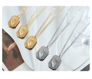 Detailed arrangement of gold and silver rectangle necklaces with celestial moon embossments
