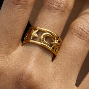Detailed close-up of 18K gold plated stainless steel ring with star and moon cutout design