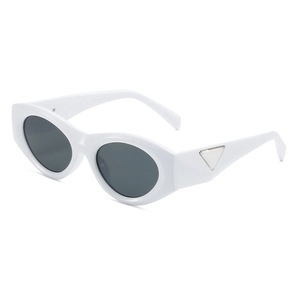 Trendy white oval cat eye sunglasses with grey lenses and silver metal triangle temple