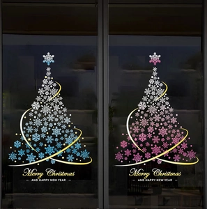 Detailed view of blue and pink gradient snowflake Christmas tree decals on glass