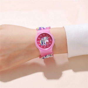 Close-up of pink unicorn kids watch with silicone strap and clear numeric dial