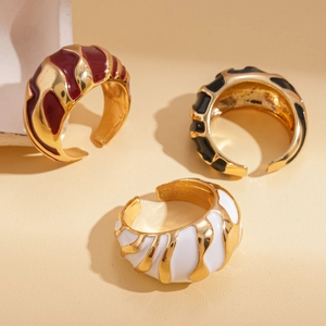 Irregular enamel open rings in wine red, black, and white colors with gold wavy texture