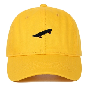 Bright yellow baseball cap featuring black skateboard embroidery and a curved brim