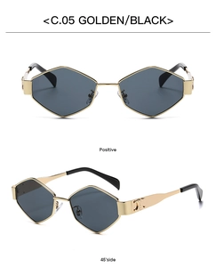Detail of golden geometric sunglasses with vintage emblem and dark lenses