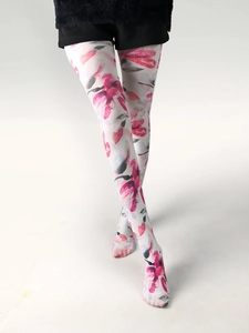 Detail shot of sheer white tights with pink and grey floral watercolor prints on legs
