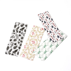 Christmas themed tissue paper set with festive red, green and gold holiday patterns