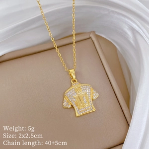 Close-up of golden number 10 jersey pendant necklace with sparkling crystal rhinestones