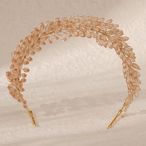 Elegant bridal headband with amber crystal beads and gold wire in feather-like design