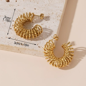 Chic 18k gold plated stainless steel spring hoop earrings on a textured stone background