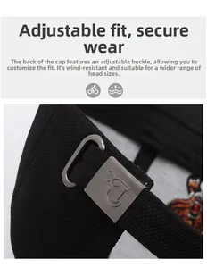 Detail of adjustable metal buckle on black baseball cap with engraved brand logo
