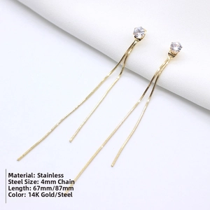 Detail of 14K gold stainless steel long tassel earrings with zirconia and snake chains