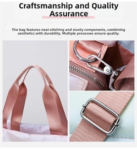 Detailed close-up of pink nylon fitness bag with durable metal D-rings and stitching