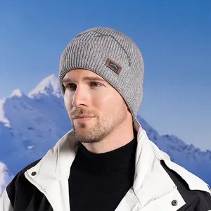 Men's grey winter knit beanie with ear protection and warm fleece lining for outdoors