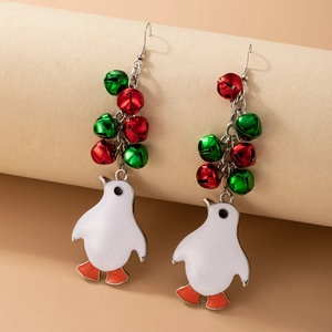 Detailed view of Christmas penguin earrings with colorful bells on a minimalist background