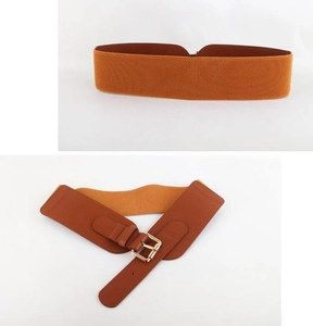 Close-up of orange brown elastic waist belt with a golden metal buckle and leather details