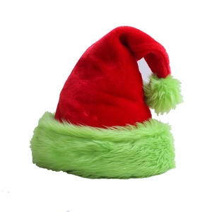 Detail of red plush Christmas hat with unique green faux fur brim and pompom