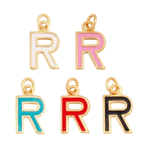 Five colorful enamel letter R pendants in white pink teal red and black with gold plating