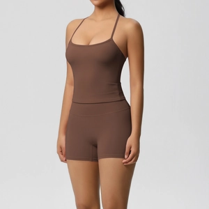 Close-up of high-waisted mocha yoga shorts and U-neck sports top on a model