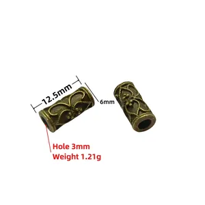 Detail view of antique bronze hollow barrel beads with flower texture and dimensions