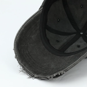 Distressed dark grey baseball cap featuring vintage frayed brim and washed cotton texture