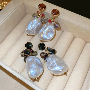 Baroque pearl earrings with vintage crystals and gold plating in a velvet jewelry box