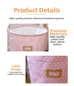 Detail of pink polka dot cotton linen storage hamper with leather label and handle