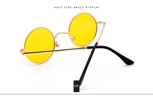Detail showing 180-degree flexible hinge on vintage round gold metal sunglasses