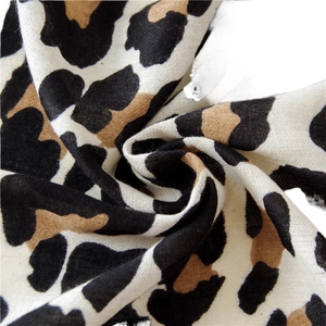 Long leopard print scarf made of soft linen cotton blend fabric with classic animal patterns