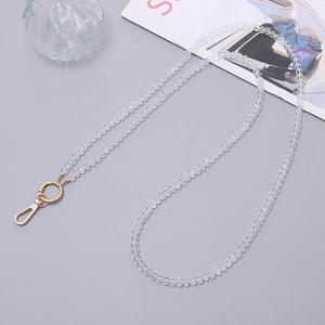 Detail view of 8mm transparent crystal beads for crossbody phone strap with golden lobster clasp