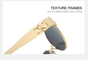 Detailed close-up of golden metal temple and vintage Triomphe embossed decoration on sunglasses