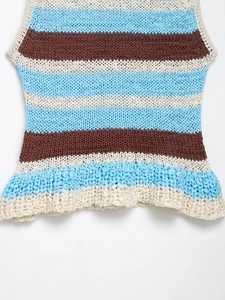 Detailed close-up of multi-colored striped crochet knit vest with intricate textures