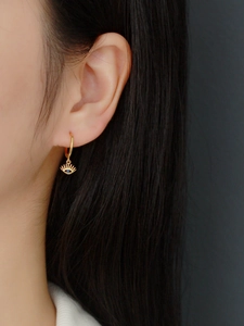 Macro view of S925 sterling silver evil eye earrings with blue zircon and gold plating