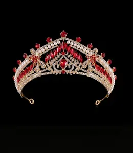 Macro shot of Baroque bridal crown with red water-drop gemstones and gold alloy base