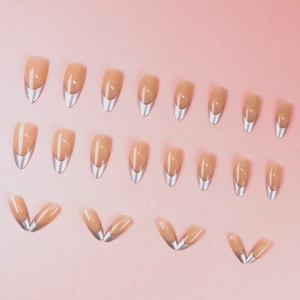 French almond fake nails in nude pink with metallic silver V-shaped tips set