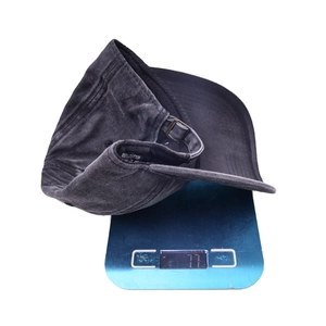 Washed vintage charcoal cotton baseball cap shown on a digital scale weighing 77 grams
