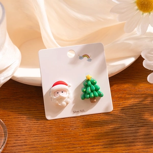 Christmas Santa and Tree S925 silver stud earrings on white silk and wood