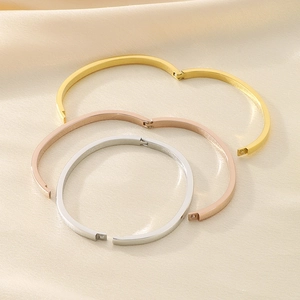 Polished stainless steel hinged bangles in gold, rose gold and silver on silk