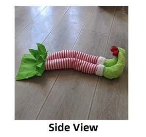 Side view of festive Christmas elf legs with red white stripes and green pointy shoes