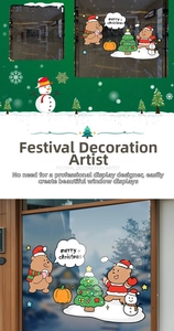 Close-up of festive Christmas window stickers featuring cute bears and a snowman