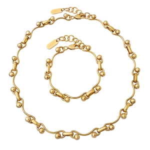 Gold chunky link jewelry set including a necklace and bracelet with Lucky engraving